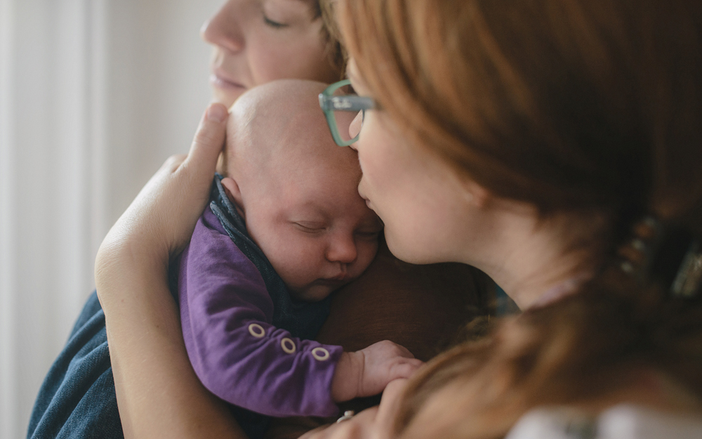 Two moms with their baby.