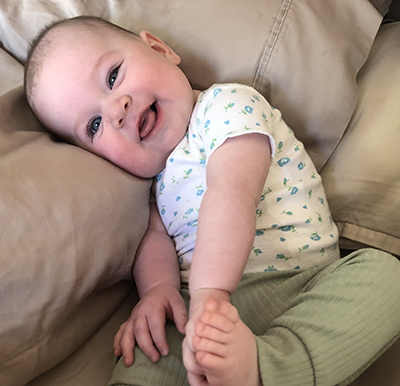Baby Norah Laber smiling.